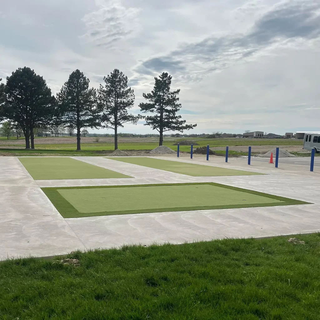 Newly installed artificial turf bocce courts and putting green on concrete pads at a community recreation facility in Celina, OH.