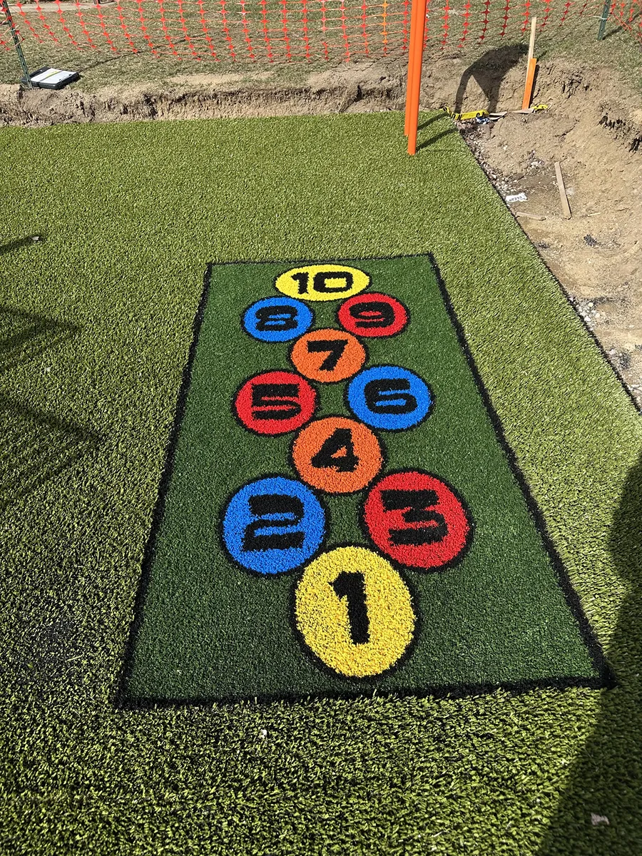 Artificial playground turf
